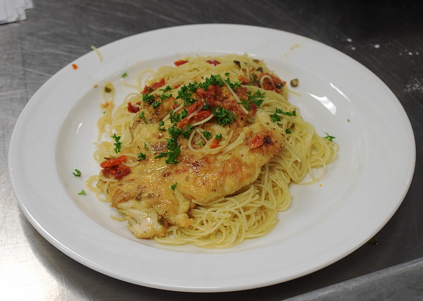 Lakewood Ranch Young Leaders Alliance members learn how to make chicken piccata with angel hair pasta.