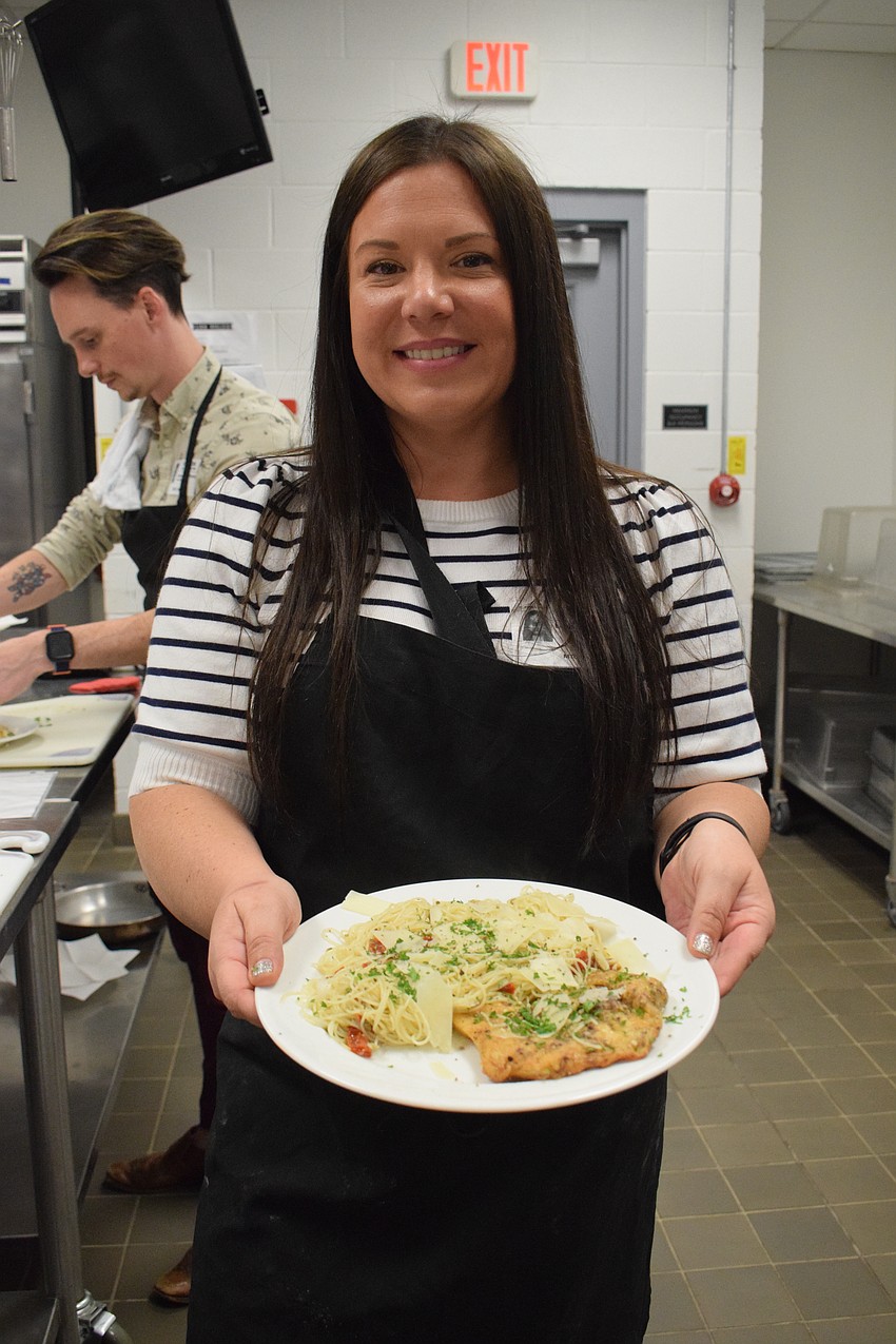Young Leaders Alliance member Leah Stuart shows off her finished meal.