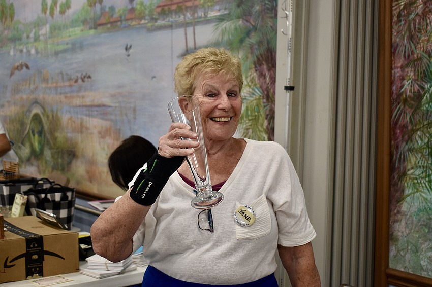 Jane Macedonia works in the glassware section of the Royal Rummage Sale on March 4, 2023.