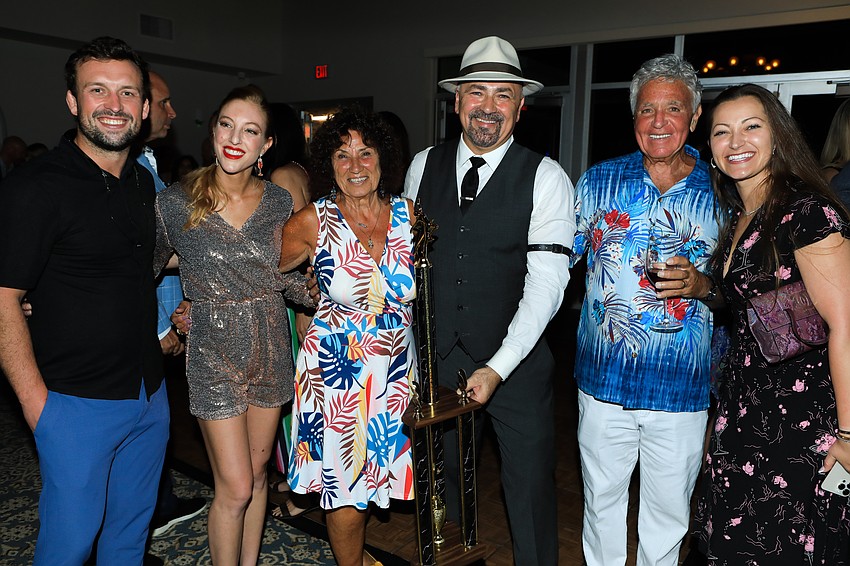 Patrick and winner Jessica Obiezinski with Rosalie Cipolla, winner Victor Cipolla, Victor Cipolla Sr. and Kira Cipolla