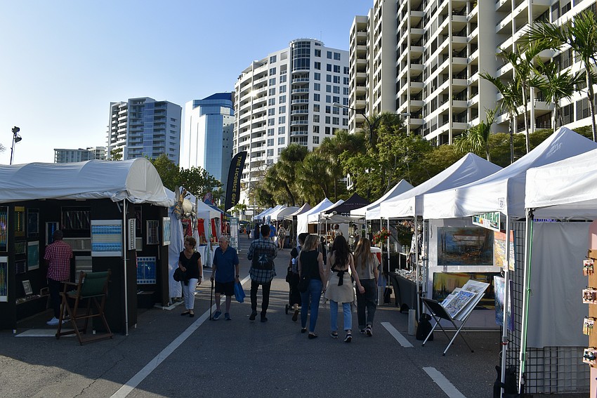 Vendors set up their booths west of JD Hamel Park at Downtown Sarasota Blues Festival.