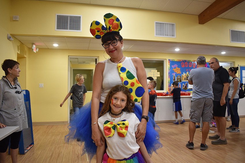Felicia and Alana DeRowe dress up whimsically for Temple Emanu-El Purim Carnival.