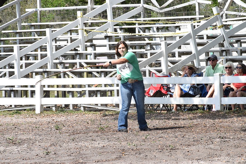 Myakka City's Chloe Butler shares her talent for whip cracking with the audience.