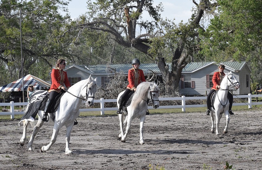 Rebecca McCullough, Sydney McCullough and Julie Herrmann perform in unison during 