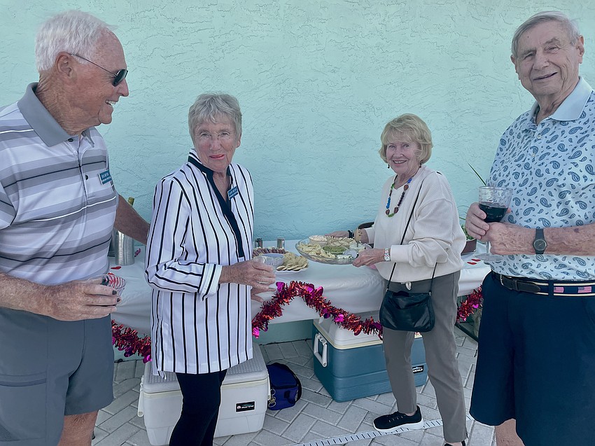 Dick and Sandy Beyer with Sue and Tom Reese at the appetizer table.