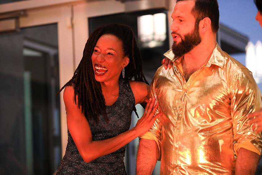 Commissioner Erik Arroyo and Monessa Salley acted out a magazine cover dance.