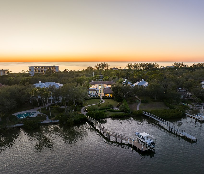 The home on 8569 Midnight Pass Road was built in 2012. It has
four bedrooms, four-and-a-half baths, a pool and 6,033 square feet of living area.