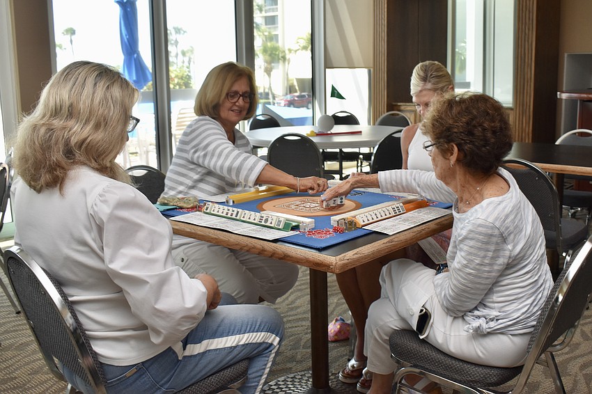 This foursome plays Mahjong.