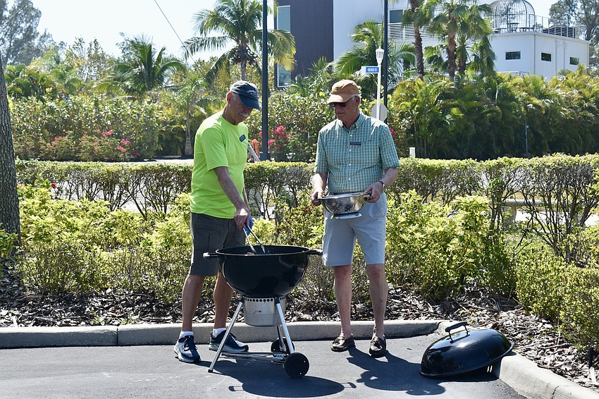 Bob Dods and George Rauch are on grill duty.