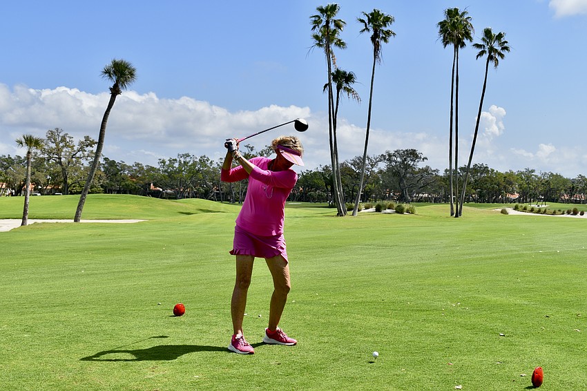 Elaine Dabney takes a swing.