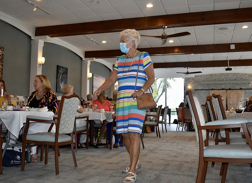 Helen Bliman models a multicolor dress for the Longboat Harbour Fashion Show