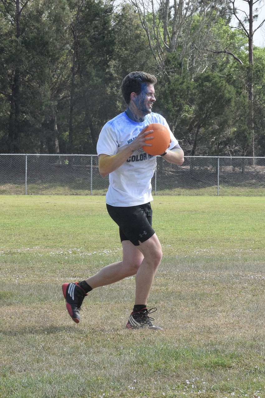 Ian Barnes, a U.S. history and civics teacher, moves quickly to make a double play.
