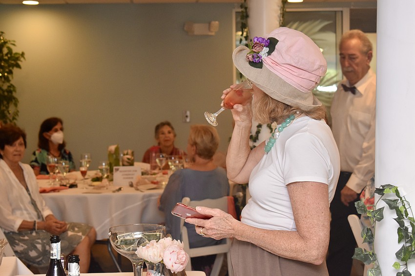 Becky Jones sips a Chambord cocktail.