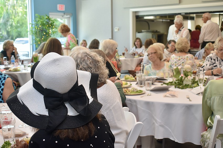 The women wear their biggest and best hats for the show.