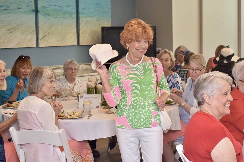 Polly Stark models a Lily Pulitzer sweater and Tommy Bahama hat.