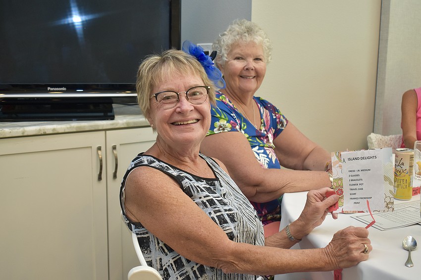 Pattie Glynn and Patty Helminski. Glynn's happy because she just won a raffle prize.