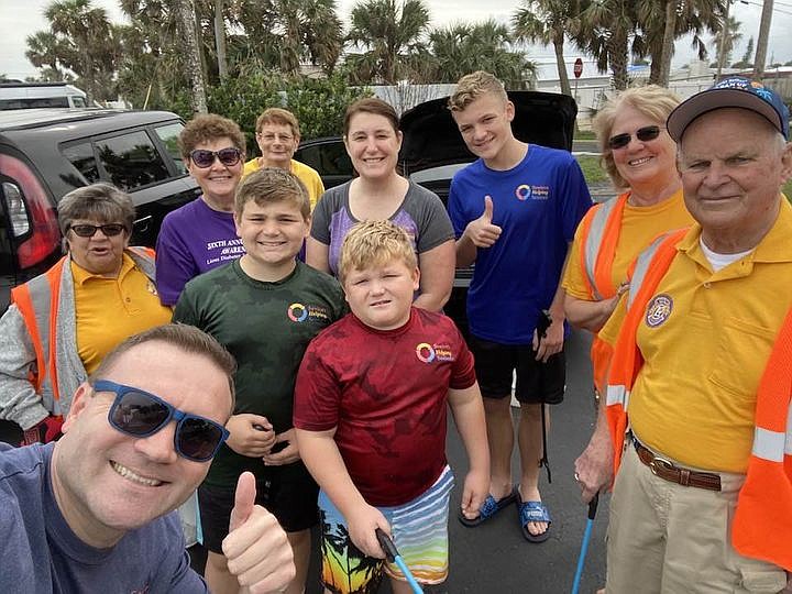 Lions Club members and their family participate in the road and beach clean up event on February 11. Courtesy photo