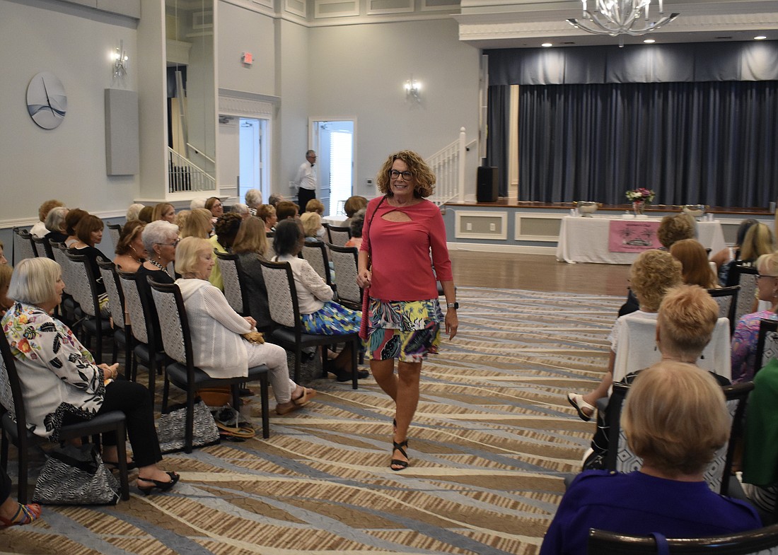 Bonnie Versele steps down the aisle in a vibrant outfit.