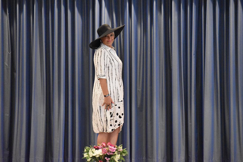 Maria Salerno enters the room dressed to impress.