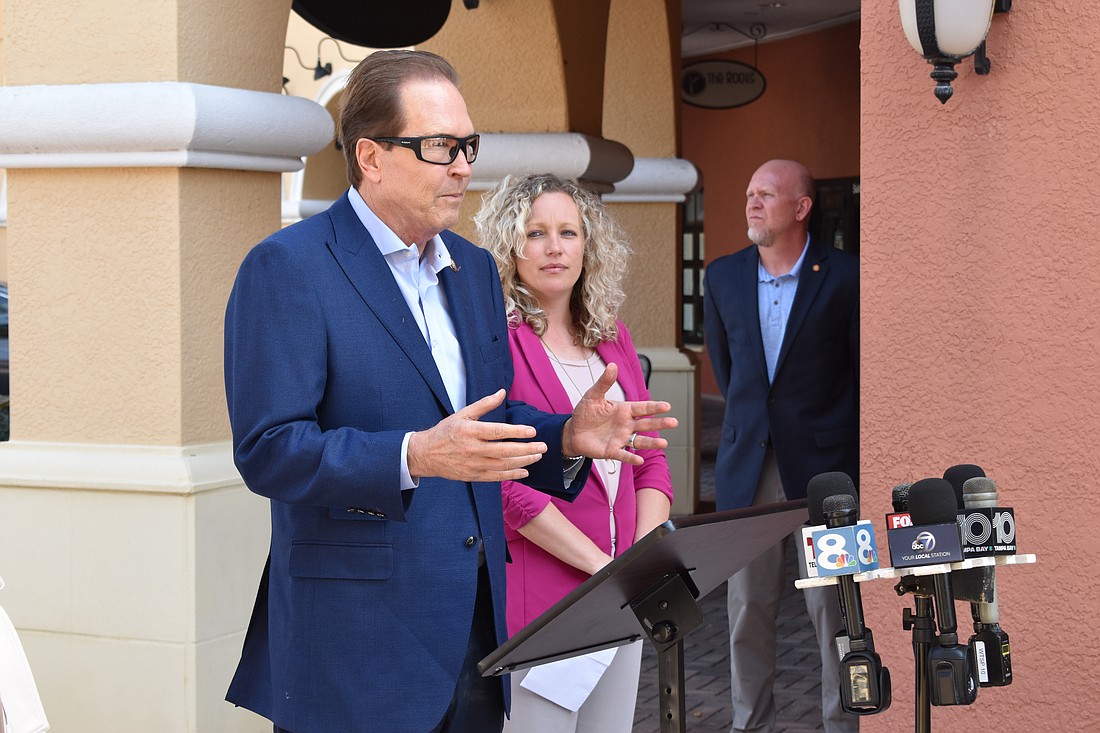 Rep. Vern Buchanan and Lakewood Ranch Business Alliance President and CEO Brittany Lamont speak at San Marco Plaza.