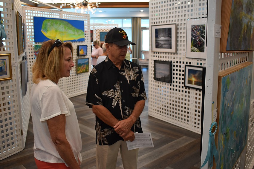Heritage Harbor's Henry and Shelley Gentile admire the artwork.