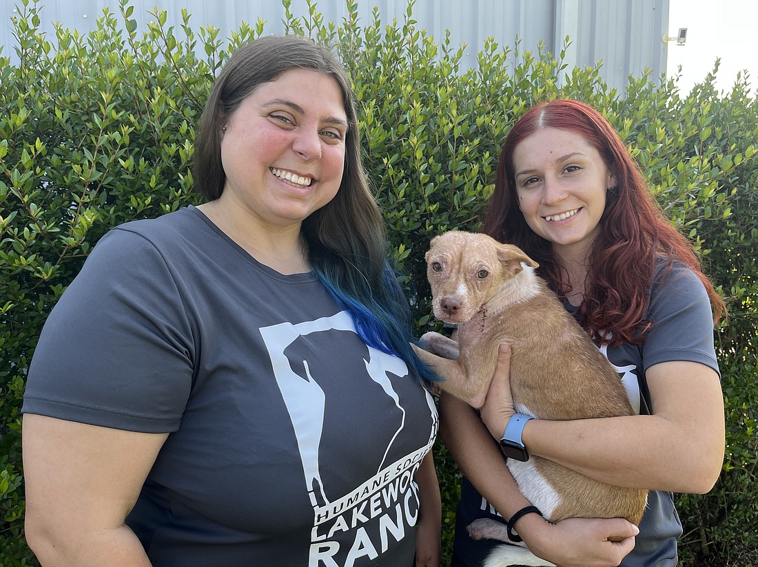 Dani Ziegler and Morgan Tinl with the Humane Society at Lakewood Ranch are grateful for funds raised during Divas and Dogs as well as funds from grants to care for animals like Zayda, who needs emergency medical services.
