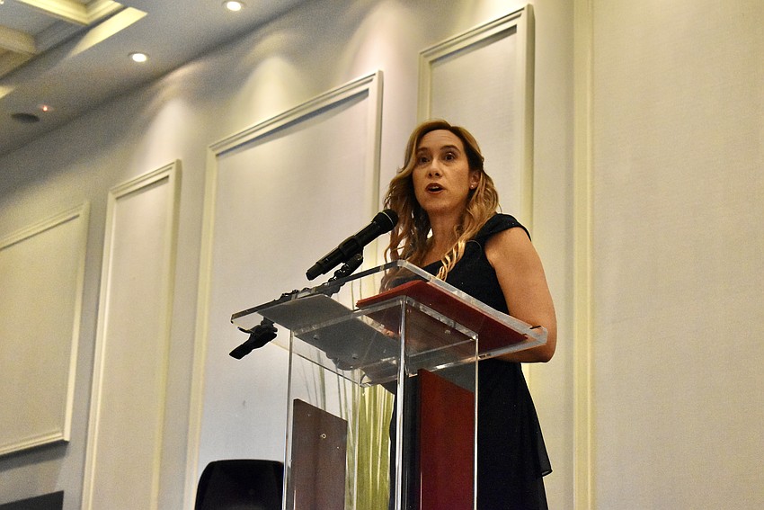 Head of Dreamers Academy Cathy Rodriguez addresses the crowd