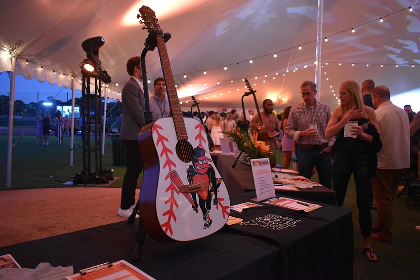 The “Athletes & Artists Play for Kids” charity event post silent auction  prizes.