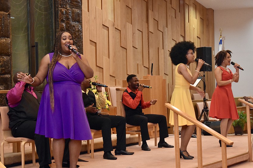 Ariel Bloom, in purple, sings with five other members of the Westcoast Black Theatre Troupe on March 12.