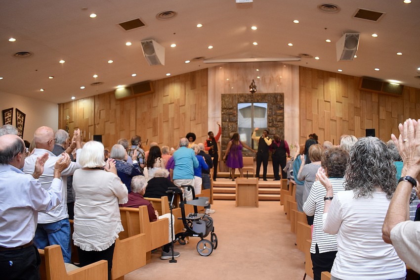The Westcoast Black Theatre Troupe receives a standing ovation.