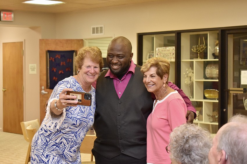 Rebecca Schlecht and Marianne Felice take a selfie with troupe member Leon Pitts II.