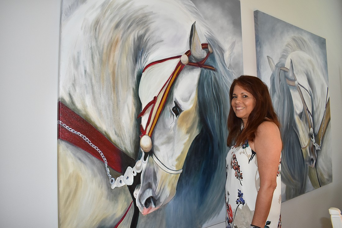 Lisa Sweeney loves painting horses, such as the Herrmann's Royal Lipizzan Stallions.