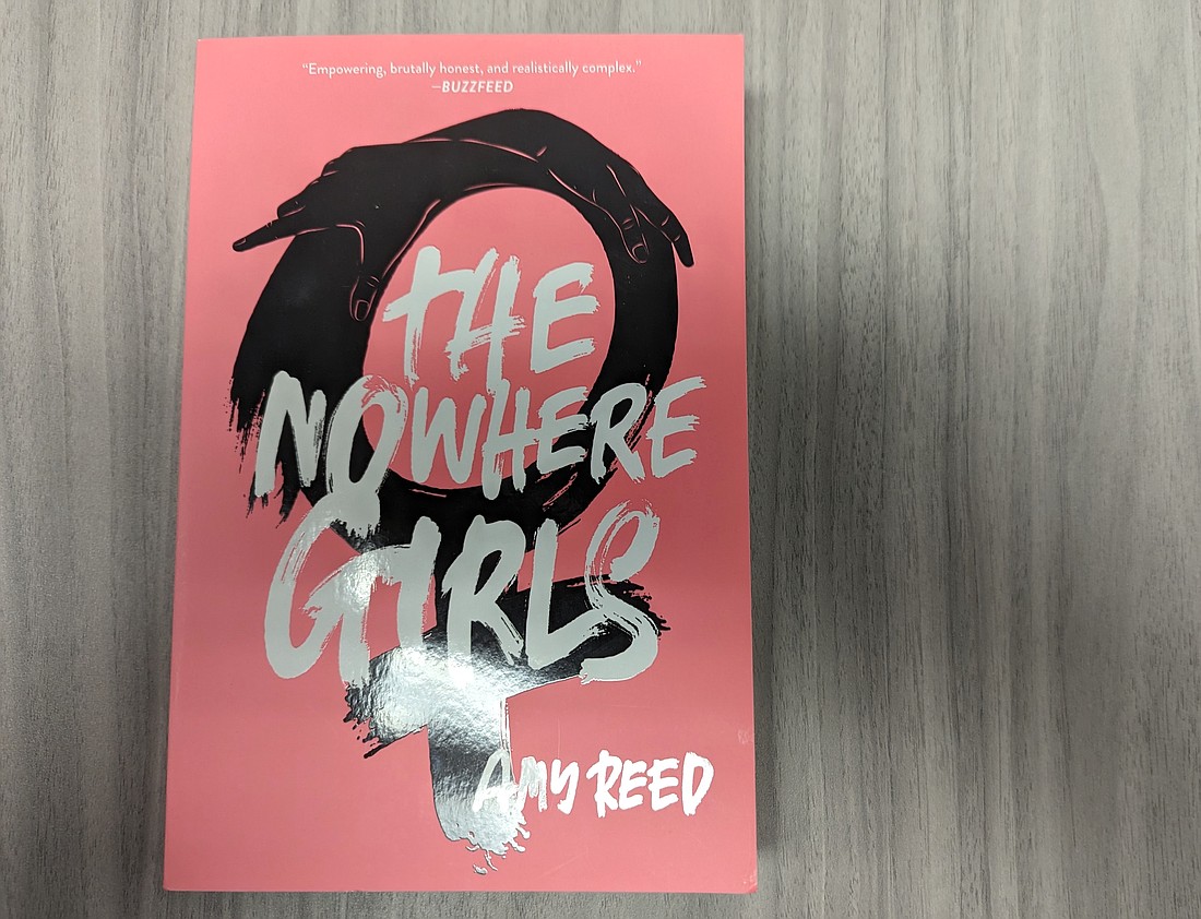 Superintendent Cathy Mittelstadt overruled a district review committee's decision to keep Amy Reed's "The Nowhere Girls" on high school library shelves.