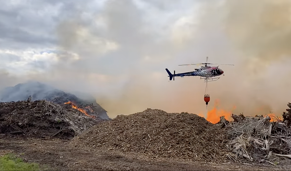 Flagler County Fire Rescue worked with the Florida Forest Service to contain a three acre mulch fire off of west State Road 100 on March 12. Image from Flagler County Fire Rescue footage.
