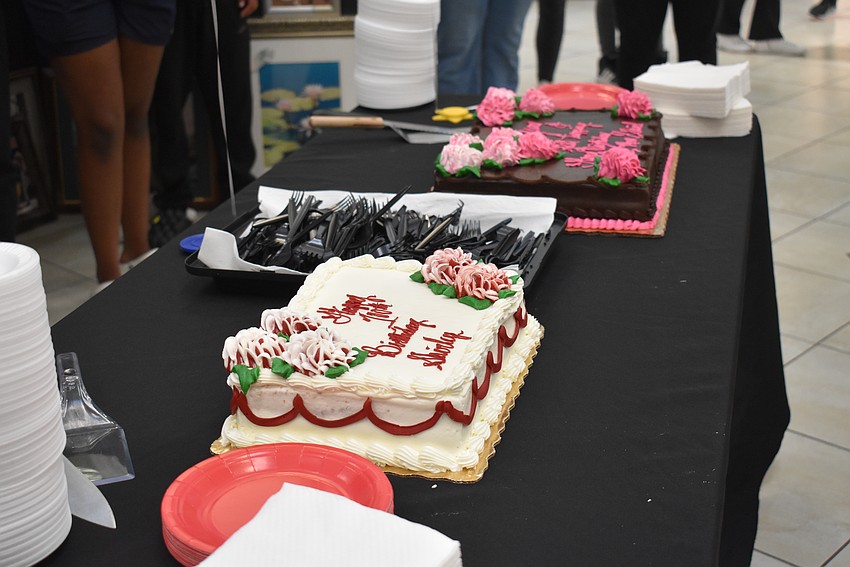Senior Friendship Centers celebrates Shirley Goodman's 100th birthday with some cake for her and the guests.