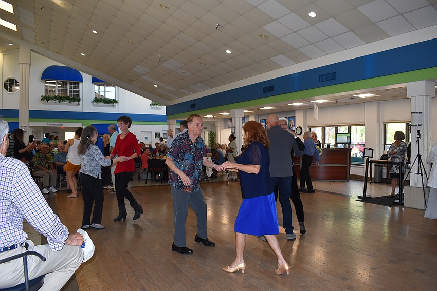 The Senior Friendship Centers guests dance at Shirley Goodman's 100th birthday party.