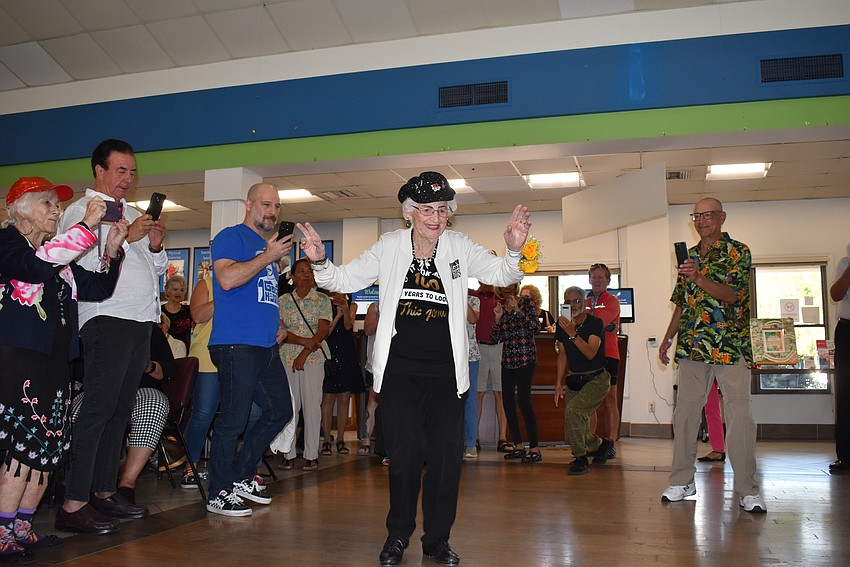 Shirley Goodman tap dances at her 100th birthday party at the Senior Friendship Center dance floor.