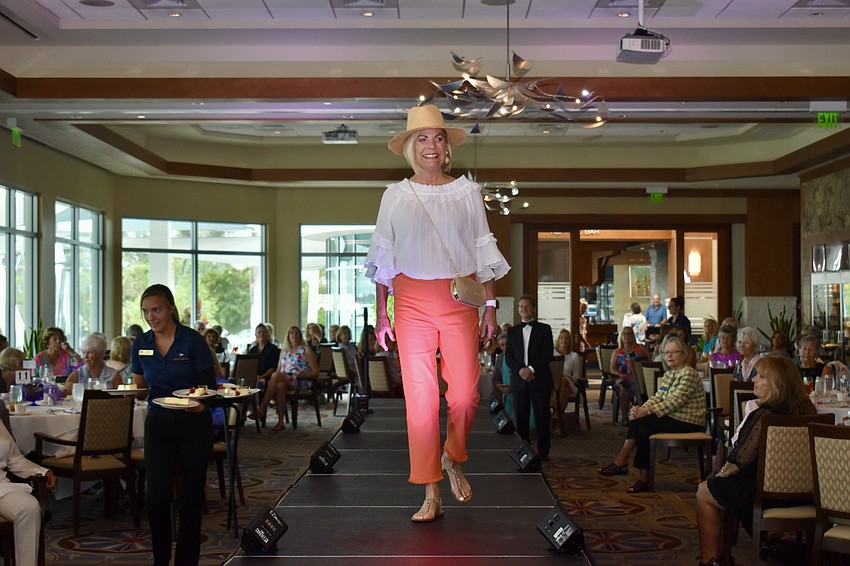 Madeline Reiber struts down the catwalk at the Sarasota Yacht Club.