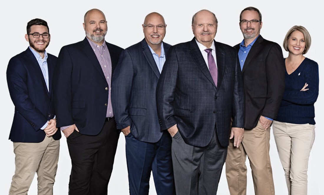 Piper Fire Protection's executive team, including Founder Terry Johnson, third from right, and President Chris Johnson, third from left.
