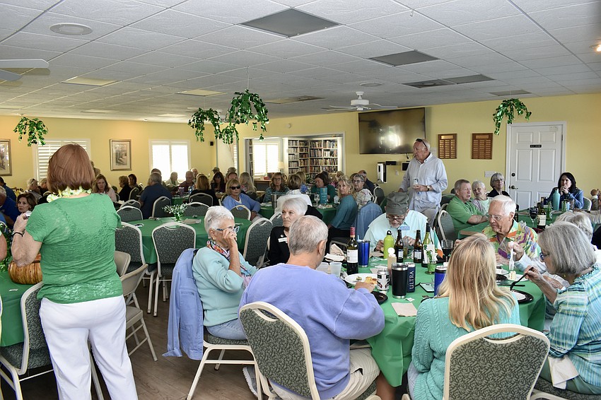 Over 100 residents celebrate St. Patrick's Day at the Spanish Main clubhouse.