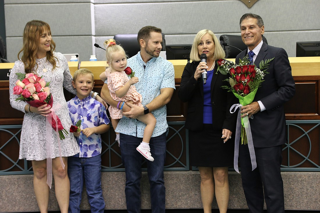 Susan Persis (second from right) has announced she will run for mayor in 2024. She is pictured here with her family during her swearing-in ceremony for the City Commission in 2022. File photo