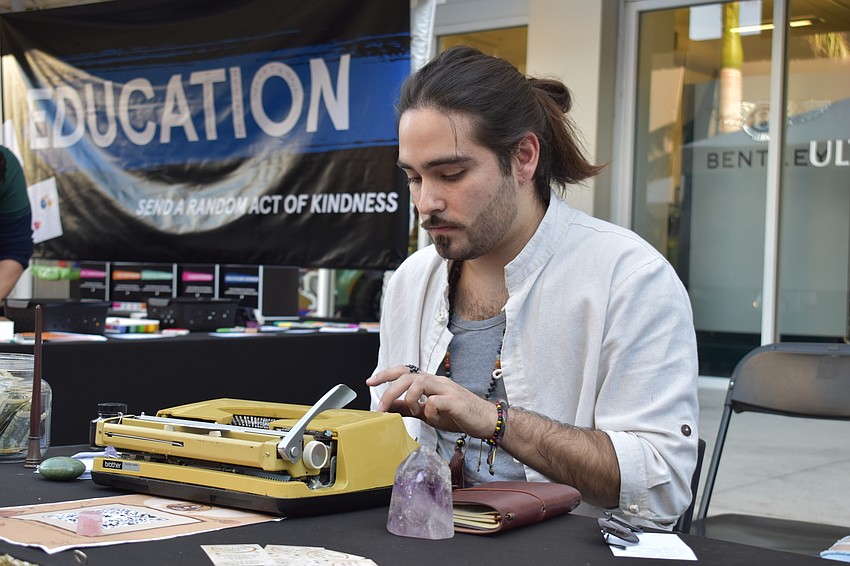 On-demand poems on topics of choice were offiered by Juan Lli, who came from Zephyrhills.