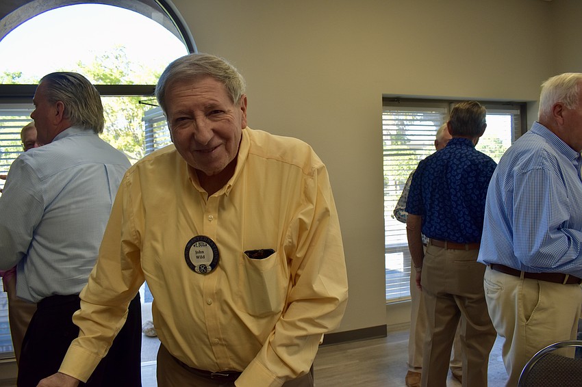 John Wild after checking in and putting on his Kiwanis pin.