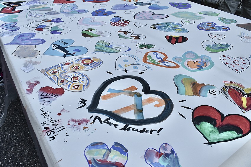 Attendees collaborated with local artist Brandon Thrift to create a community art piece.