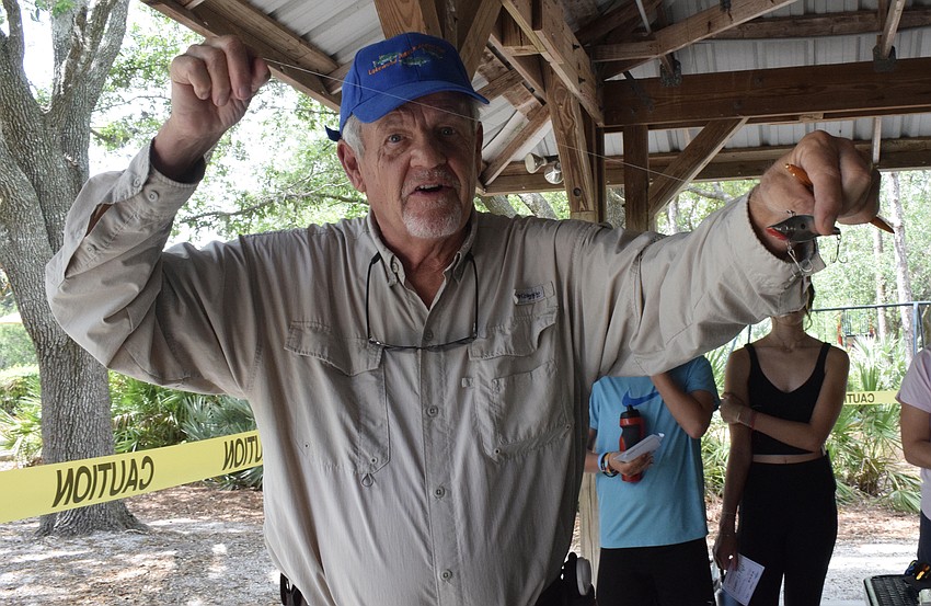 Ed Van Stedum, a member of the Lakewood Ranch Angler's Club, teaches children about different lures they can use.