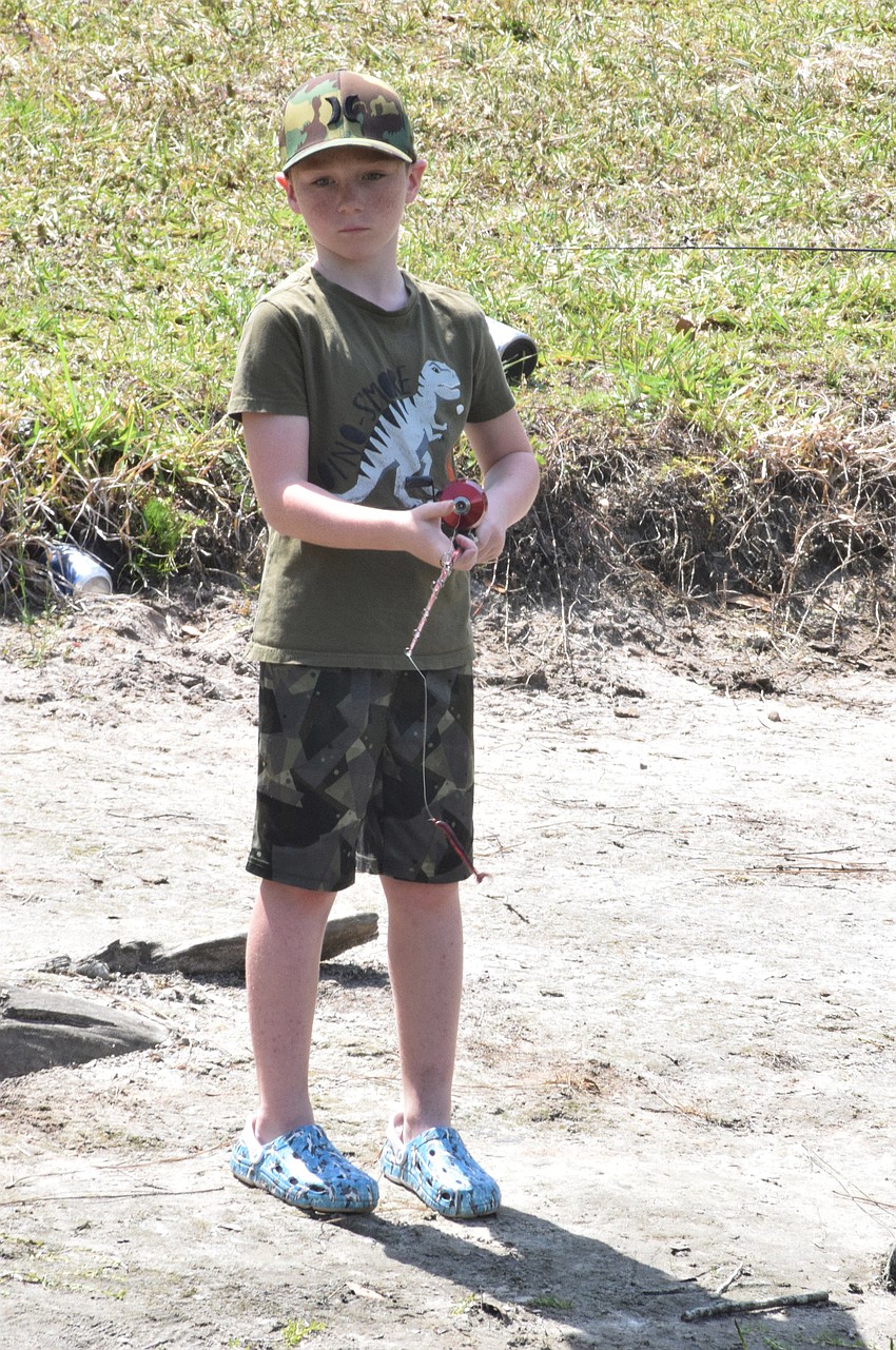 Lakewood Ranch's Chase Berthold, who is 8, practices casting.