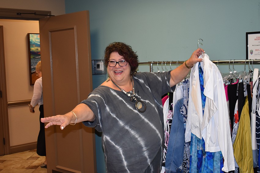 Aliki Gable of Evelyn and Arthur of Sarasota gives the models some last-minute instructions.