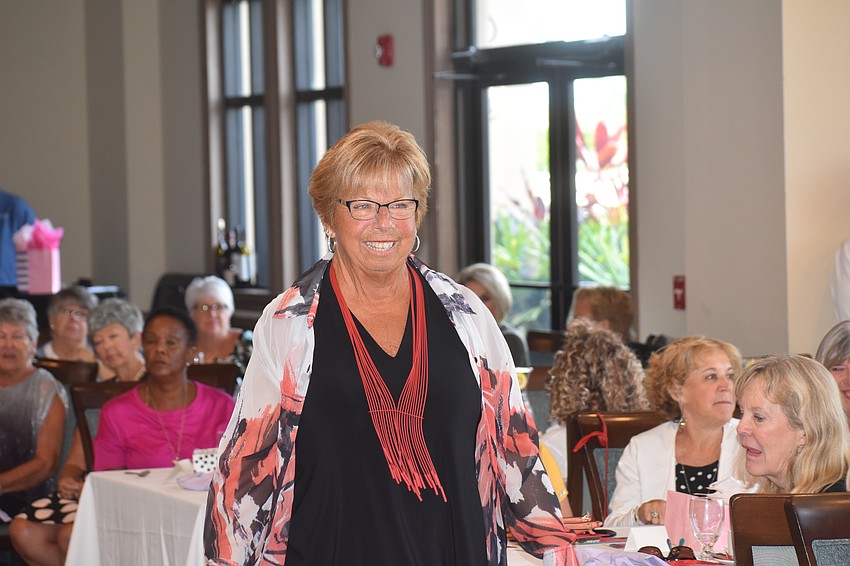 River Strand's Sandy Franks makes her way though the crowd at River Strand Country Club.