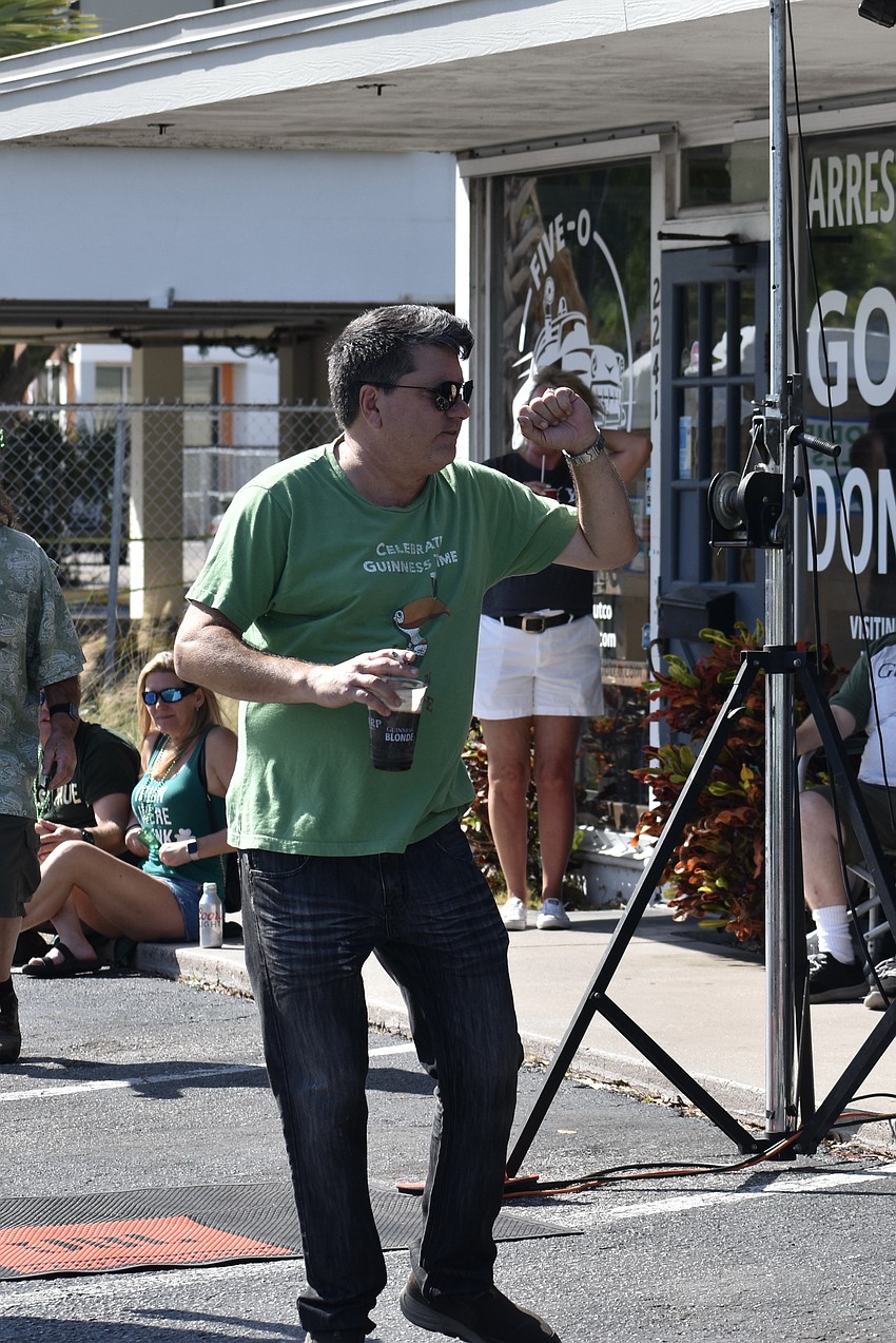 Walter Beer is in a dancing mood as his friend Andy Thomas performs.