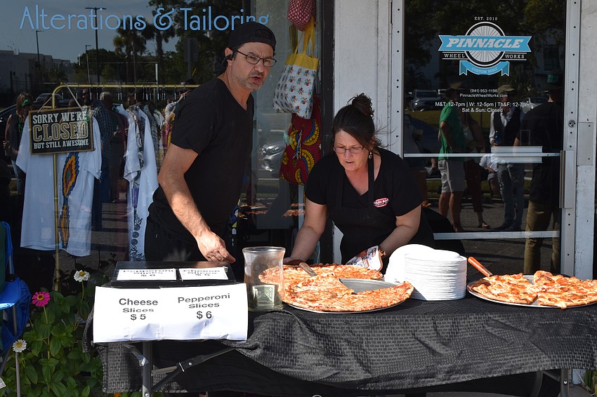 Angie Sexton and Rocco Cartia of Fresh Mozzarella Pizzeria set up a food stand.